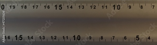 Metal ruler with numbers. Abstraction