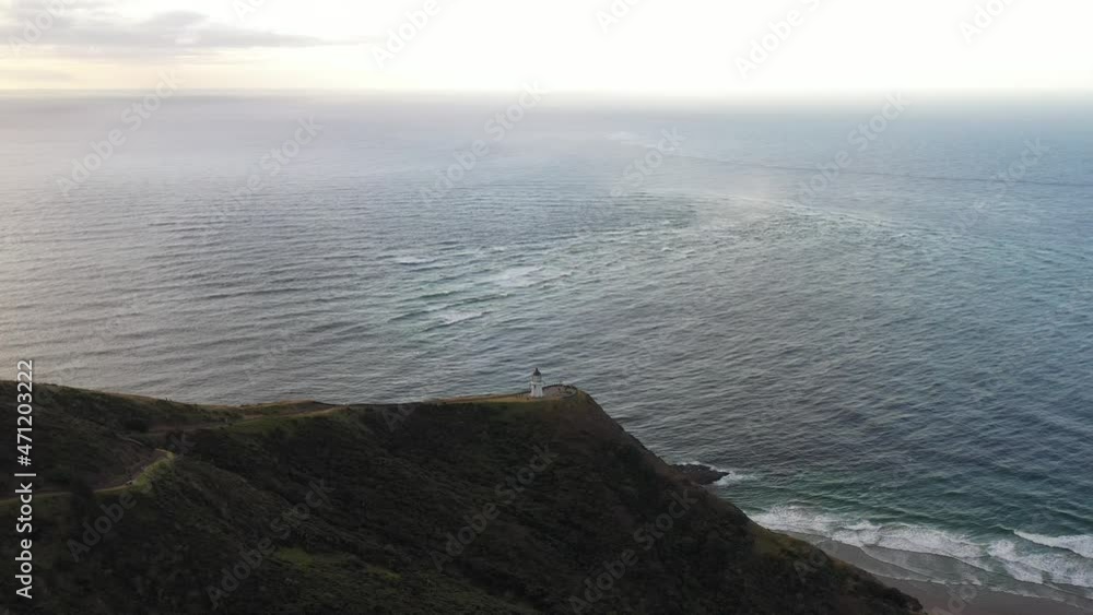 Aerial, drone shot of Cape Reinga. Lighthouse, New Zealand, North of North Island. Place where Pacific ocean meets Tasman sea. Aerial, drone shot of Cape Reinga. Lighthouse, New Zealand, North of North Island. Place where Pacific ocean meets Tasman sea.