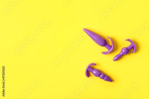 Anal plugs on color background