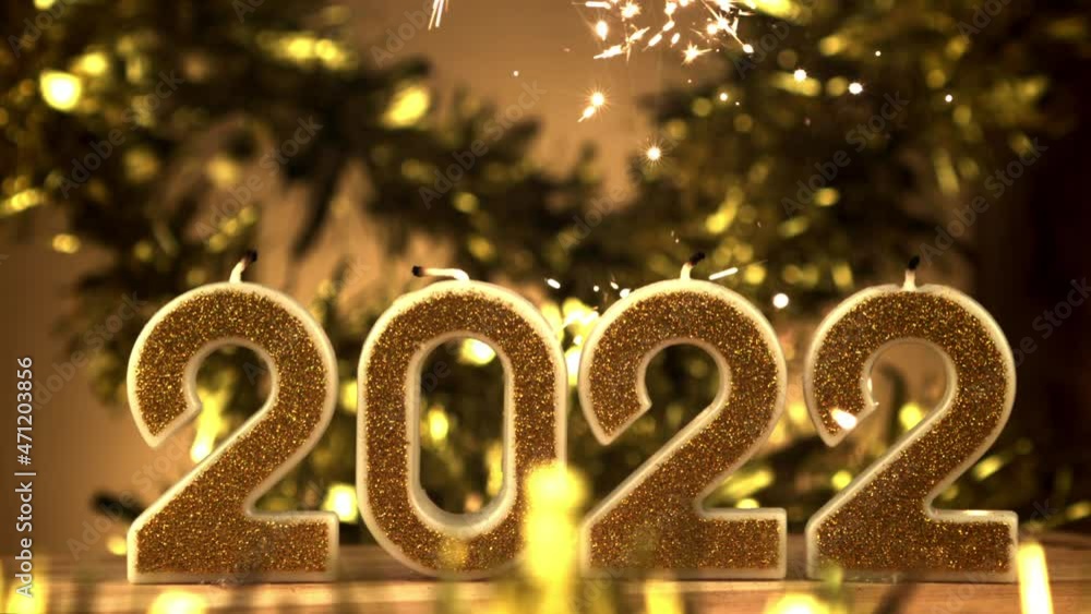 Celebrating the New Year 2022 at home. On a yellow background.Filmed is slow motion 1000 fps. High quality FullHD footage Celebrating the New Year 2022 at home. On a yellow background.Filmed is slow motion 1000 fps. High quality FullHD footage