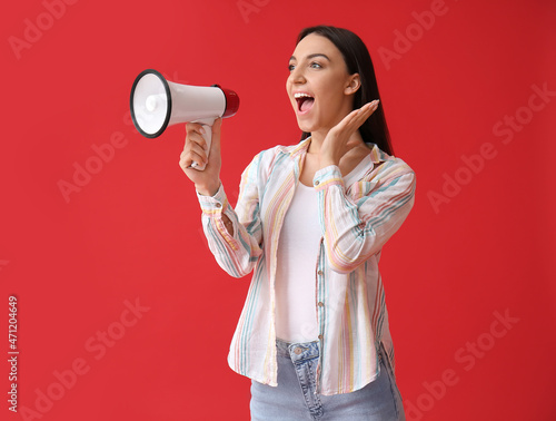 Young woman shouting into m...