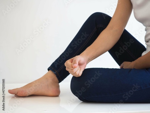 Young woman with knee pain. closeup photo, blurred.