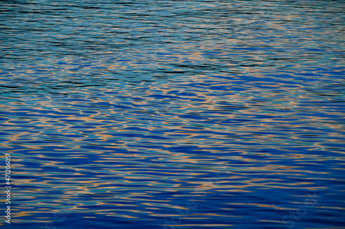waves on the danube river in the evening light