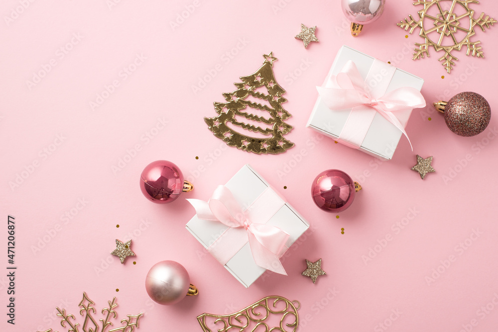 Top view photo of row composition christmas decorations pink balls gold bell pine snowflake shaped ornaments stars white gift boxes with pink bows and sequins on isolated pastel pink background Top view photo of row composition christmas decorations pink balls gold bell pine snowflake shaped ornaments stars white gift boxes with pink bows and sequins on isolated pastel pink background