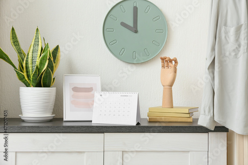 Paper calendar on chest of ...