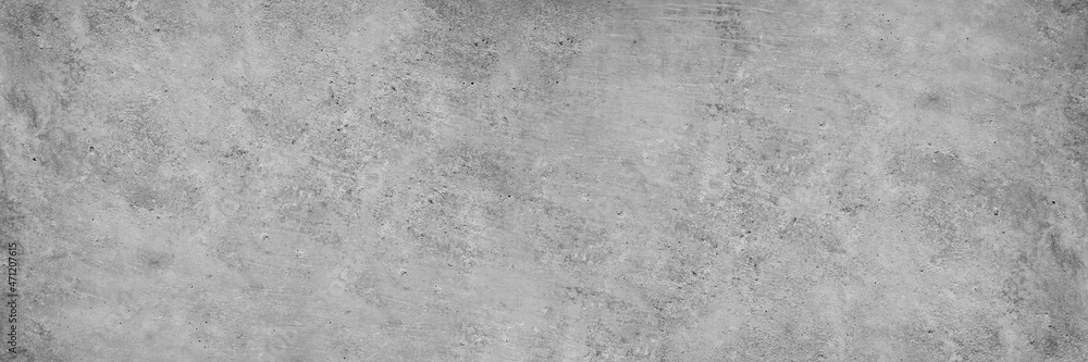 Gray concrete wall. Cement surface texture. Grunge background with copy space for design. Wide banner. Gray concrete wall. Cement surface texture. Grunge background with copy space for design. Wide banner.