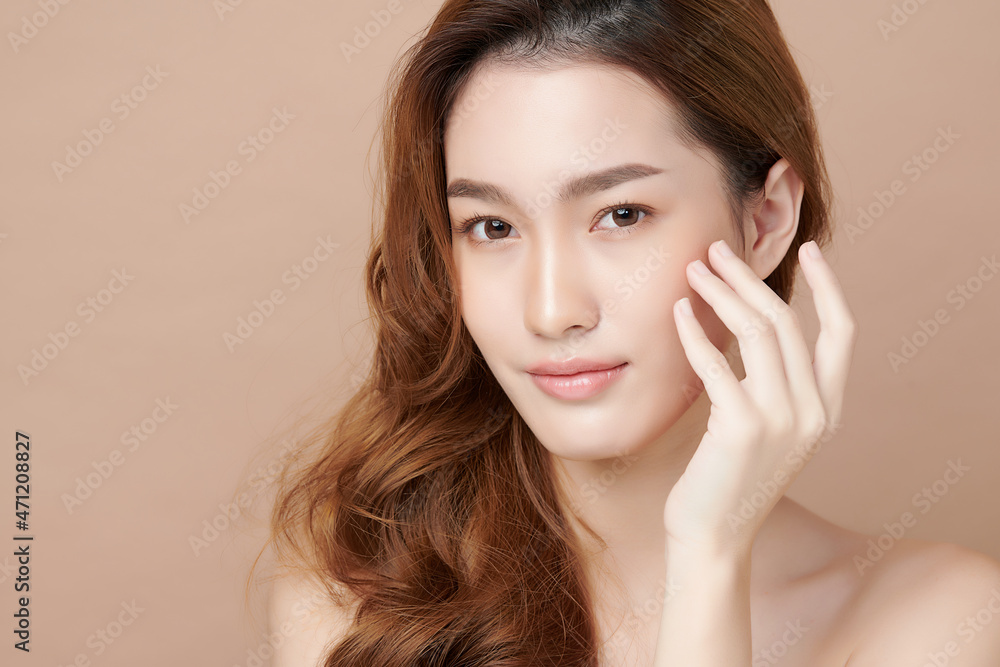 Beautiful young asian woman with clean fresh skin on beige background, Face care, Facial treatment, Cosmetology, beauty and spa, Asian women portrait. Beautiful young asian woman with clean fresh skin on beige background, Face care, Facial treatment, Cosmetology, beauty and spa, Asian women portrait.