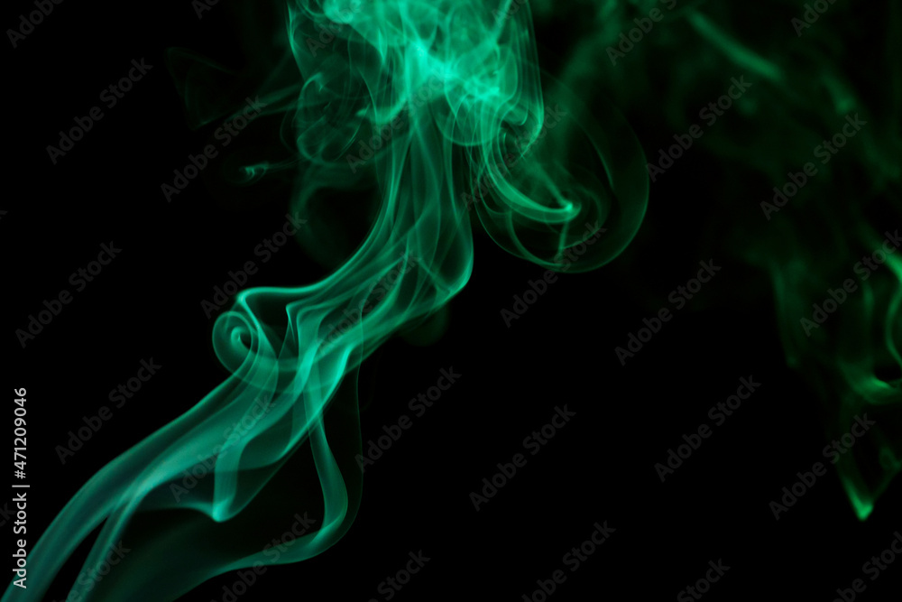 Abstract colorful smoke Weipa. Personal vaporizers fragrant steam. Concept of alternative non-nicotine smoking. Color smoke on dark background. E-cigarette. Evaporator. Blurry image, soft focus