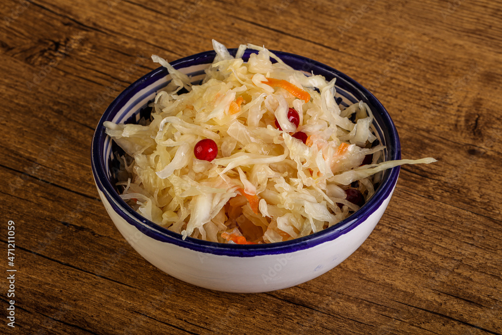 Sauerkraut with cranberry in the bowl Sauerkraut with cranberry in the bowl