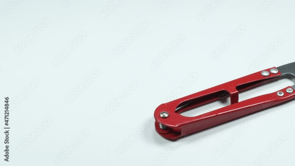 Traditional old design of scissors in Asia isolated on the white background. Classic tailor clipper made from metal blade. Traditional old design of scissors in Asia isolated on the white background. Classic tailor clipper made from metal blade.