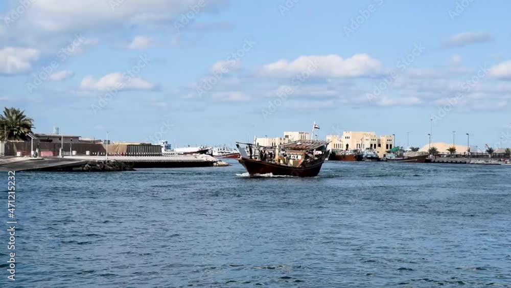 Traditional dhows wooden boat sailing at Dubai creek Traditional dhows wooden boat sailing at Dubai creek