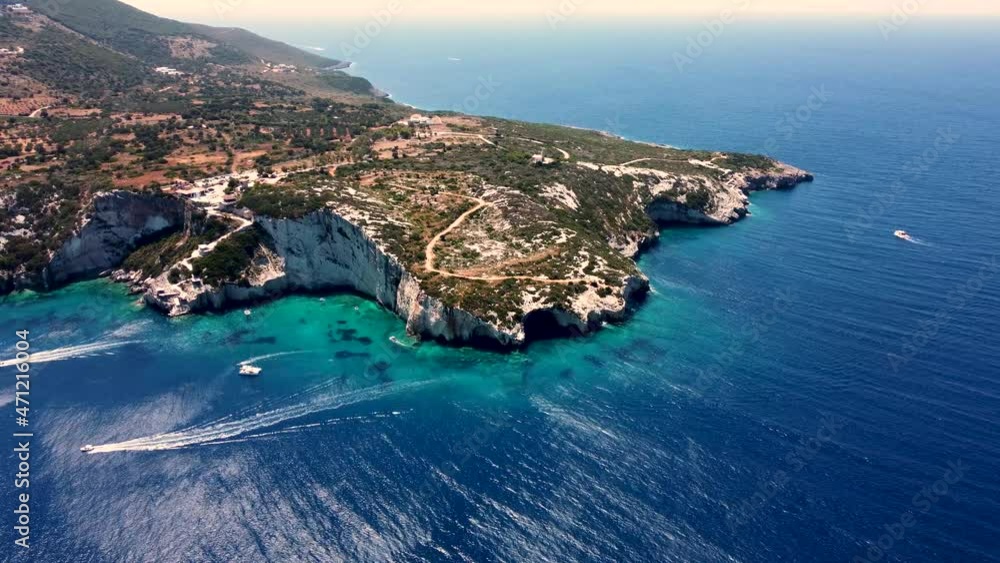 Zakynthos, island with golden beaches and massive rocky coasts. White beach, crystal clear water, stacks, rock formation, boat, summer, vacation, sea Zakynthos, island with golden beaches and massive rocky coasts. White beach, crystal clear water, stacks, rock formation, boat, summer, vacation, sea