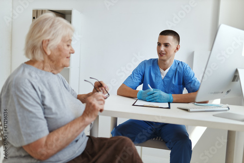 elderly woman talking to a doctor professional consultation © SHOTPRIME STUDIO