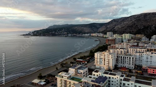 high aerial push in at sunset, shengjin albania along the albanian coastline of the adriatic sea photo