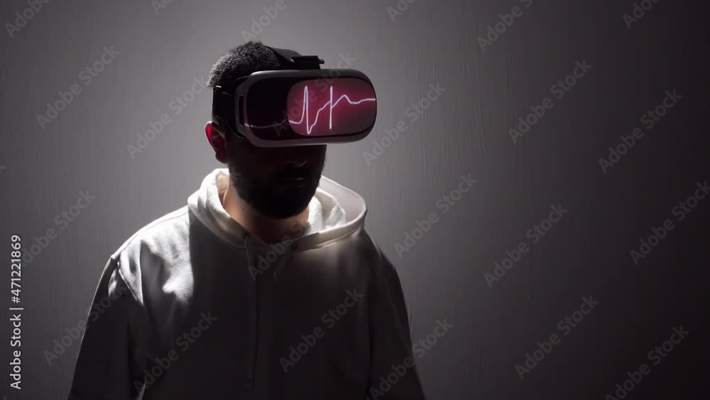 virtual reality and medicine concept. person wearing vr goggles with heart rhythm projection and virtual diagnosis. virtual reality and medicine concept. person wearing vr goggles with heart rhythm projection and virtual diagnosis.