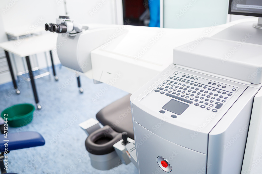 Microscopic apparatus for testing eyesight. Ophthalmology and treatment of eye diseases. Eye clinic, optometrist concept Microscopic apparatus for testing eyesight. Ophthalmology and treatment of eye diseases. Eye clinic, optometrist concept