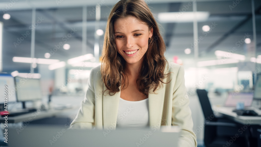 Young Happy Businesswoman Using Computer in Modern Office with Colleagues. Stylish Beautiful Manager Smiling, Working on Commercial, Financial and Marketing Projects. Specialist in Diverse Team.