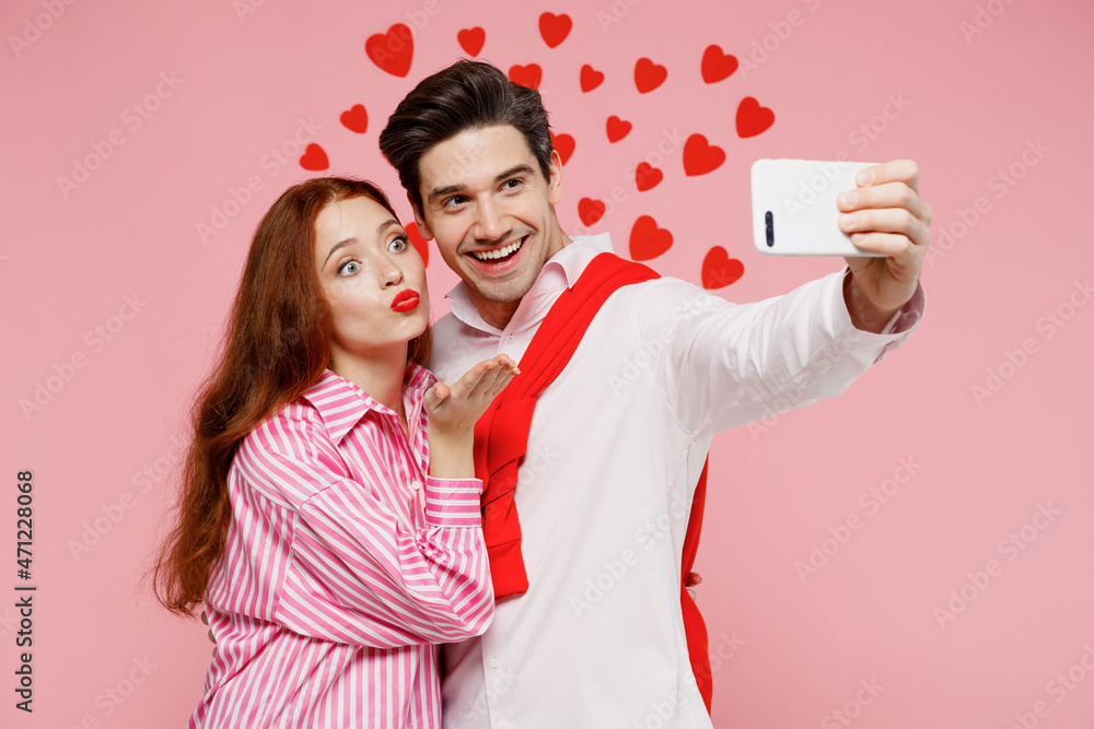 Young couple two friends woman man in casual shirt doing selfie shot on  mobile cell phone