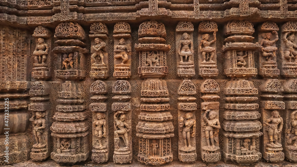 Carvings of  musicians and dancers that almost completely cover the platform, walls and pillars of the hall on Bhoga Mandapa or the dance hall, Sun Temple, Konark, India.