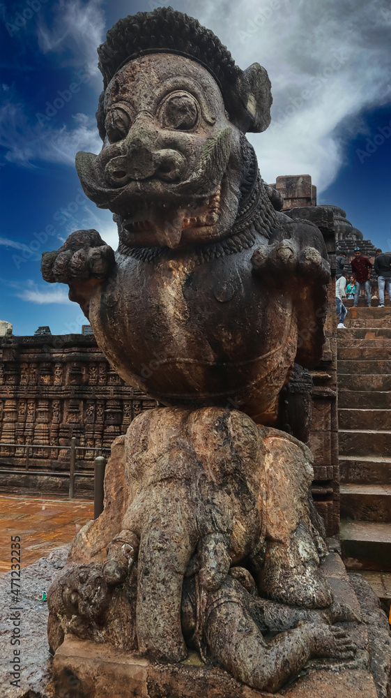 Rock-cut statue of huge Lion riding over couching elephant at entrance of  Bhoga Mandapa of Sun Temple, Konark, Orissa, India,