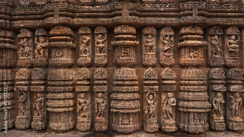 Carvings of  musicians and dancers that almost completely cover the platform, walls and pillars of the hall on Bhoga Mandapa or the dance hall, Sun Temple, Konark, India.