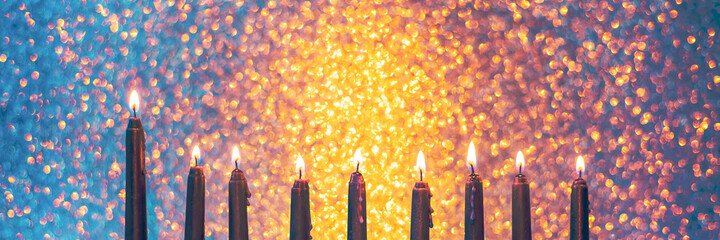 Jewish holiday Hanukkah website banner background with simbol menorah traditional candelabra and burning candles