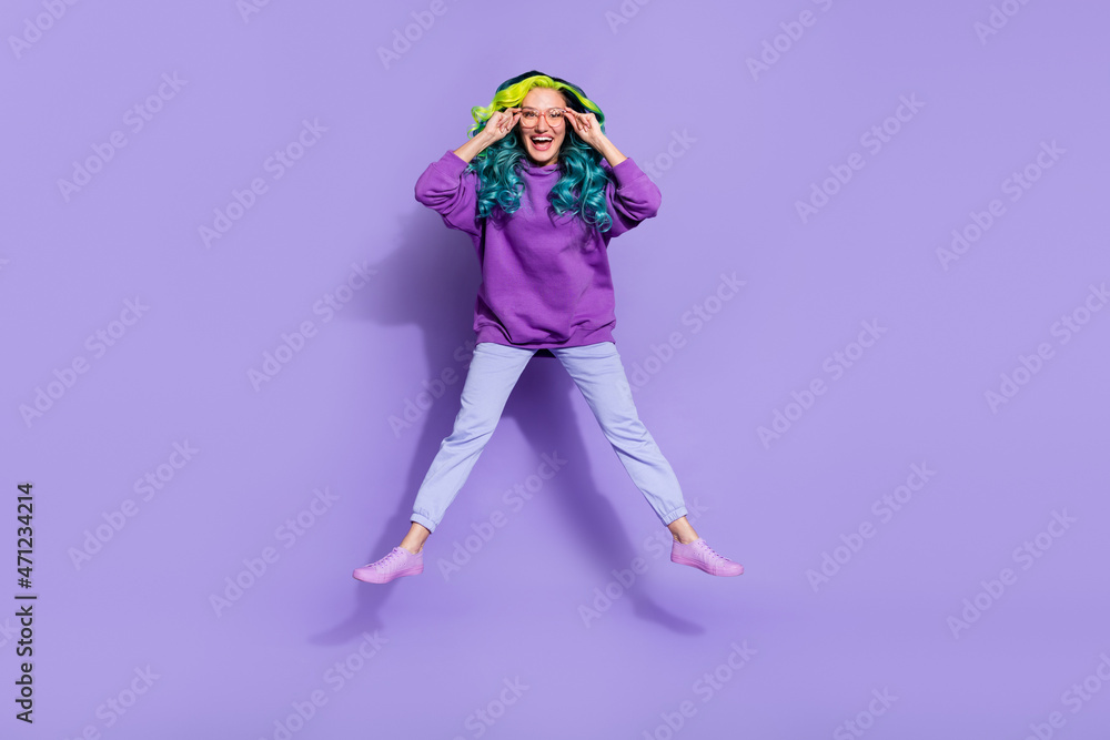 Full size photo of cheerful youth lady touch specs eyeglasses jump up isolated over purple color background Full size photo of cheerful youth lady touch specs eyeglasses jump up isolated over purple color background