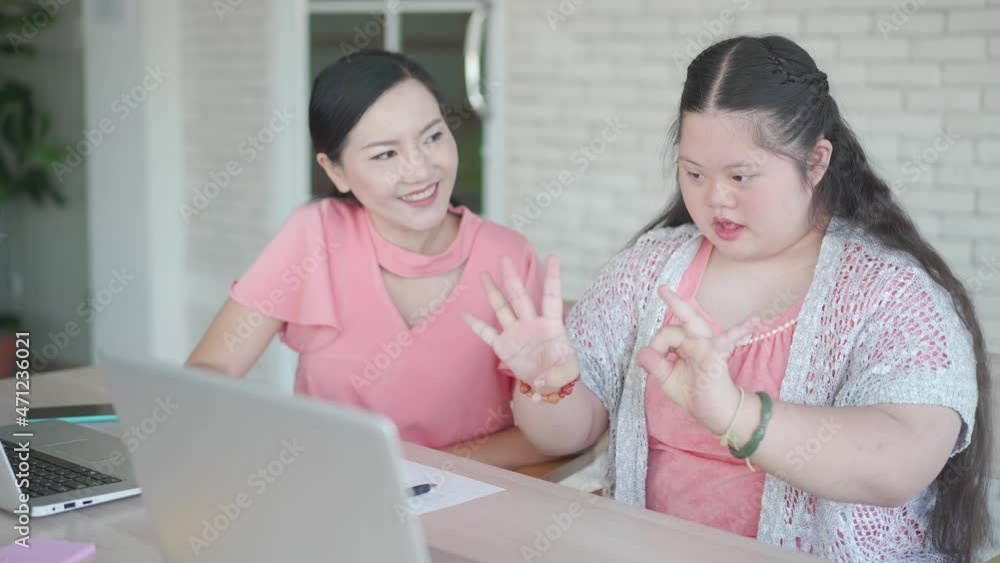 Girl learning with mother at home Girl learning with mother at home