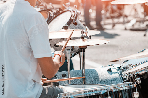 Canvas Print A musician plays the drums in close-up on the street