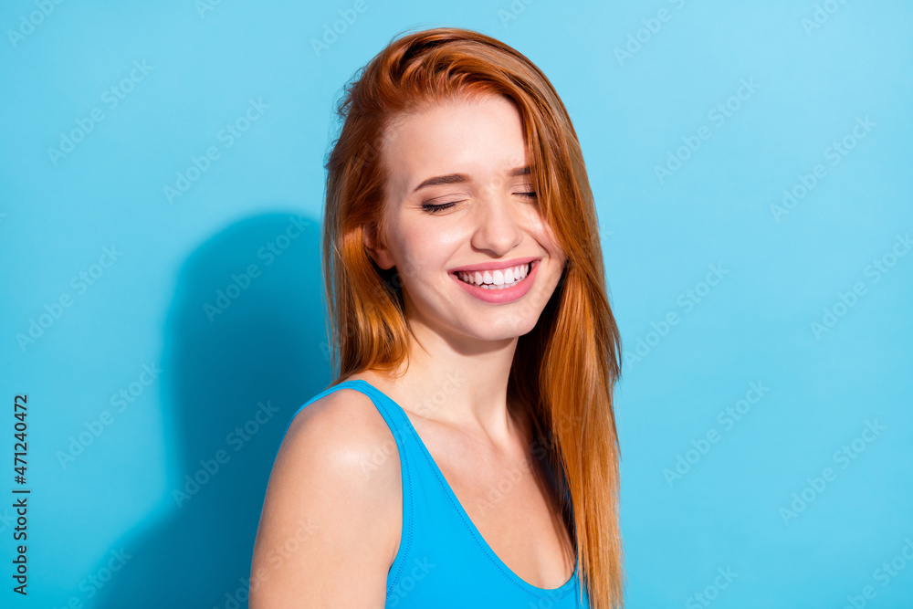 Portrait of attractive dreamy cheerful girl posing enjoying isolated over bright blue color background Portrait of attractive dreamy cheerful girl posing enjoying isolated over bright blue color background