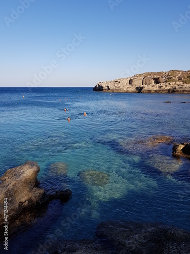 People swimming in the mediterranean sea in Rhodes island Greece