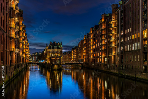 High dynamic and detailed photography of the illuminated Speicherstadt in Hamburg at the blue hour in autumn (November 2021)