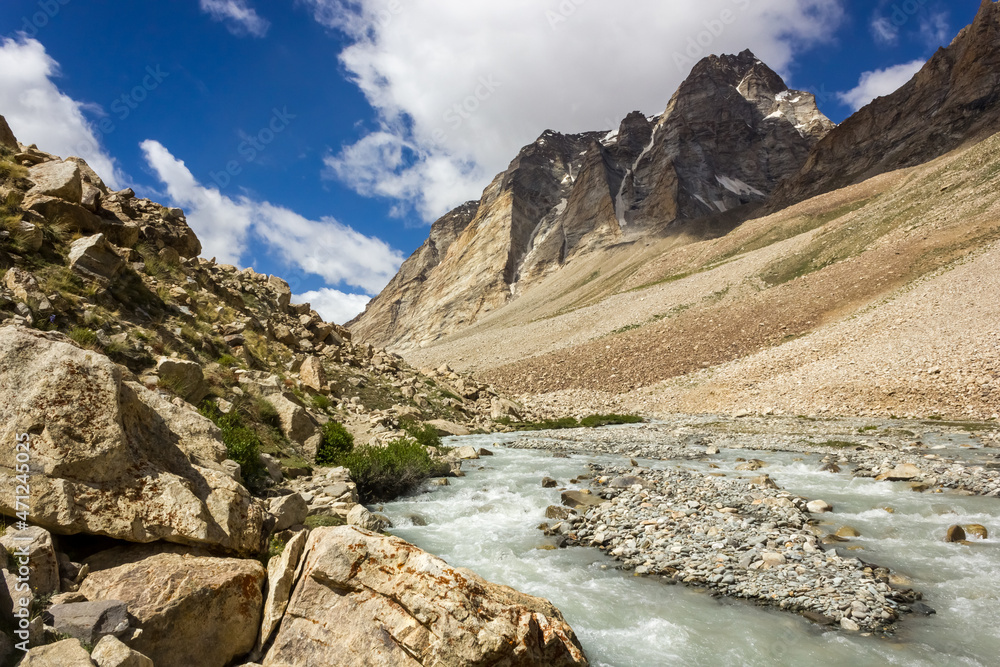 The Zanskar river flows through the high rocky mountains on a trekking route in the Great Himalayan range in Ladakh in north India. The Zanskar river flows through the high rocky mountains on a trekking route in the Great Himalayan range in Ladakh in north India.