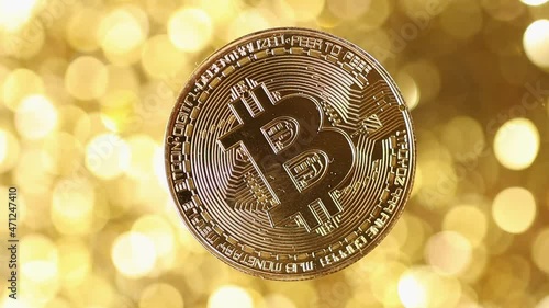 Bitcoin BTC Rotating Bitcoin Gold Coin Rotating on a Golden Background
