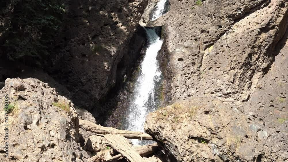 Cascading waterfall plunging over volcanic rock - Piedra Falls, Colorado. Cascading waterfall plunging over volcanic rock - Piedra Falls, Colorado.
