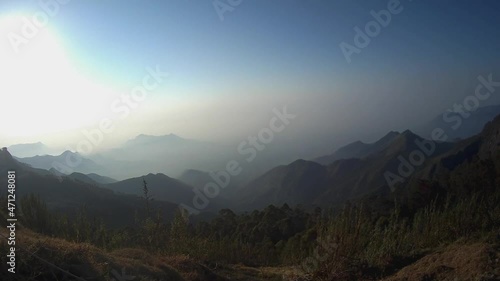 Blue sky color change with mountains time lapse is taken at coakers walk kodaikanal tamilnadu india. it is showing the color change in the sky while sunrise. photo