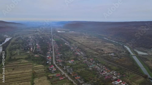 Aerial top dow view over suburb area village near mountain high altitude aerial top down view over countryside of Karpaty photo