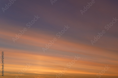 Abstract background of a calm, romantic, gentle sky. Blue and orange sky © V_Saratovtseva