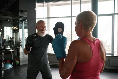 Engaging boxing trainer teaches woman to self-defense © Svitlana