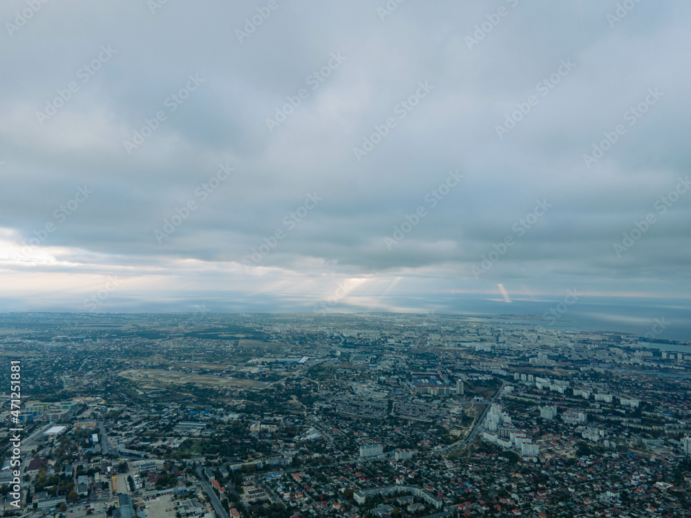 Fototapeta premium Beautiful storm clouds over the city. Panorama from above.