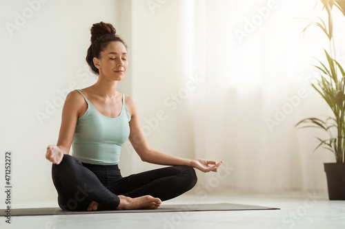 Morning Meditation. Beautiful Calm Woman Meditating At Home In Lotus Position