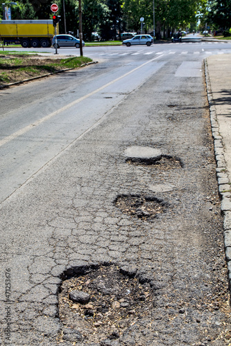 Holes in the asphalt road