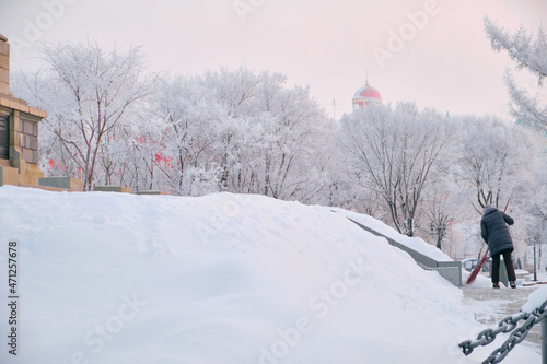 Culture and Recreation Park of Khabarovsk, Russia after heavy snowfall in the morning at sunrise. Trees in the snow.