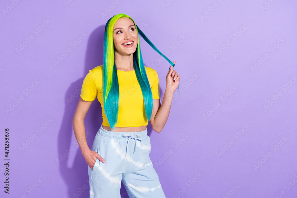 Photo of smiling attractive lady look copyspace dreaming vivid cyan color hair isolated on violet color background Photo of smiling attractive lady look copyspace dreaming vivid cyan color hair isolated on violet color background