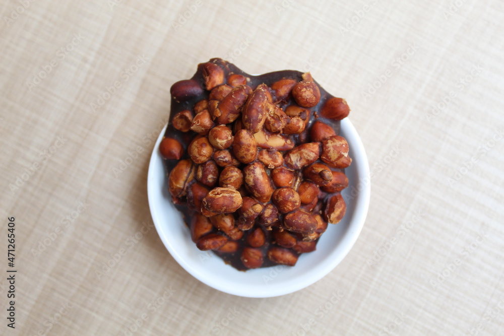 Gula kacang, is a traditional snack from Indonesia, made from roasted peanuts and brown sugar. Also called as Ampyang Gula kacang, is a traditional snack from Indonesia, made from roasted peanuts and brown sugar. Also called as Ampyang