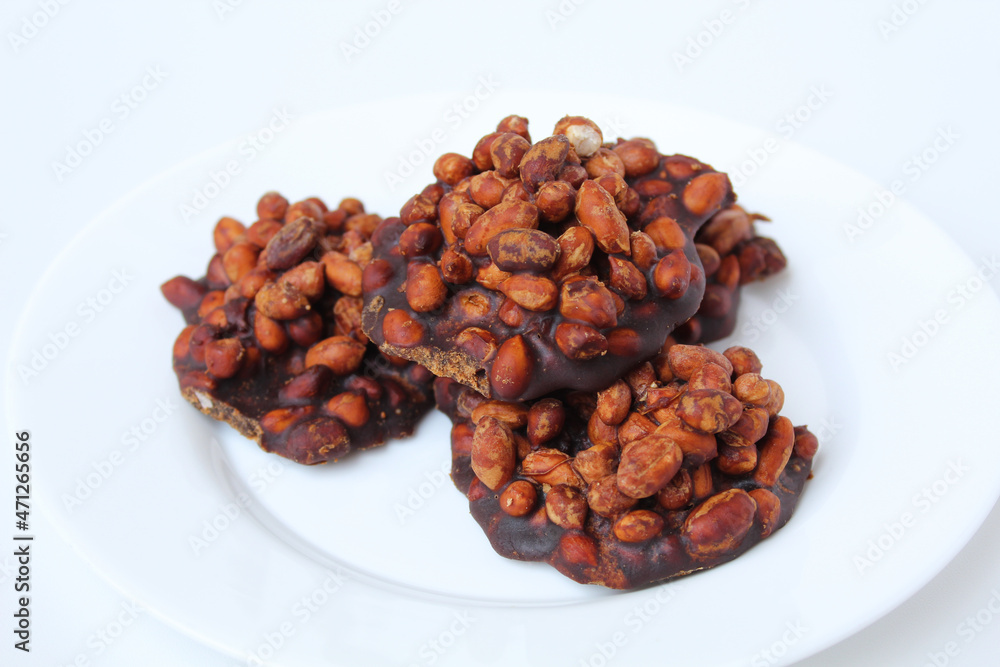 Gula kacang, is a traditional snack from Indonesia, made from roasted peanuts and brown sugar. Also called as Ampyang Gula kacang, is a traditional snack from Indonesia, made from roasted peanuts and brown sugar. Also called as Ampyang
