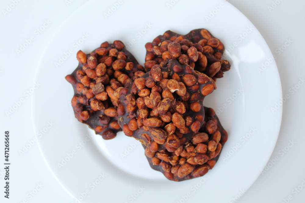 Gula kacang, is a traditional snack from Indonesia, made from roasted peanuts and brown sugar. Also called as Ampyang Gula kacang, is a traditional snack from Indonesia, made from roasted peanuts and brown sugar. Also called as Ampyang