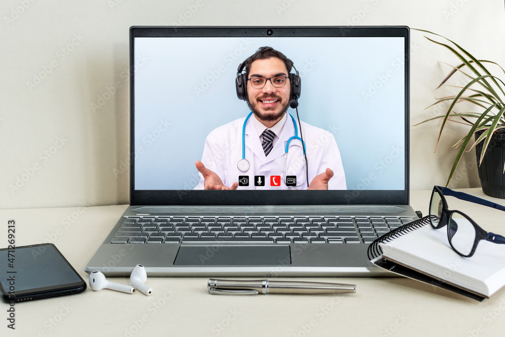 Tele medicine concept. Middle eastern male doctor wear headset talking to patient. Tele medicine concept. Middle eastern male doctor wear headset talking to patient.