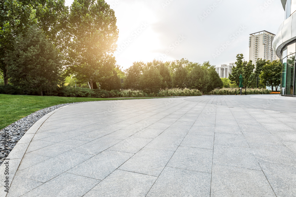 Empty square floor and green forest background