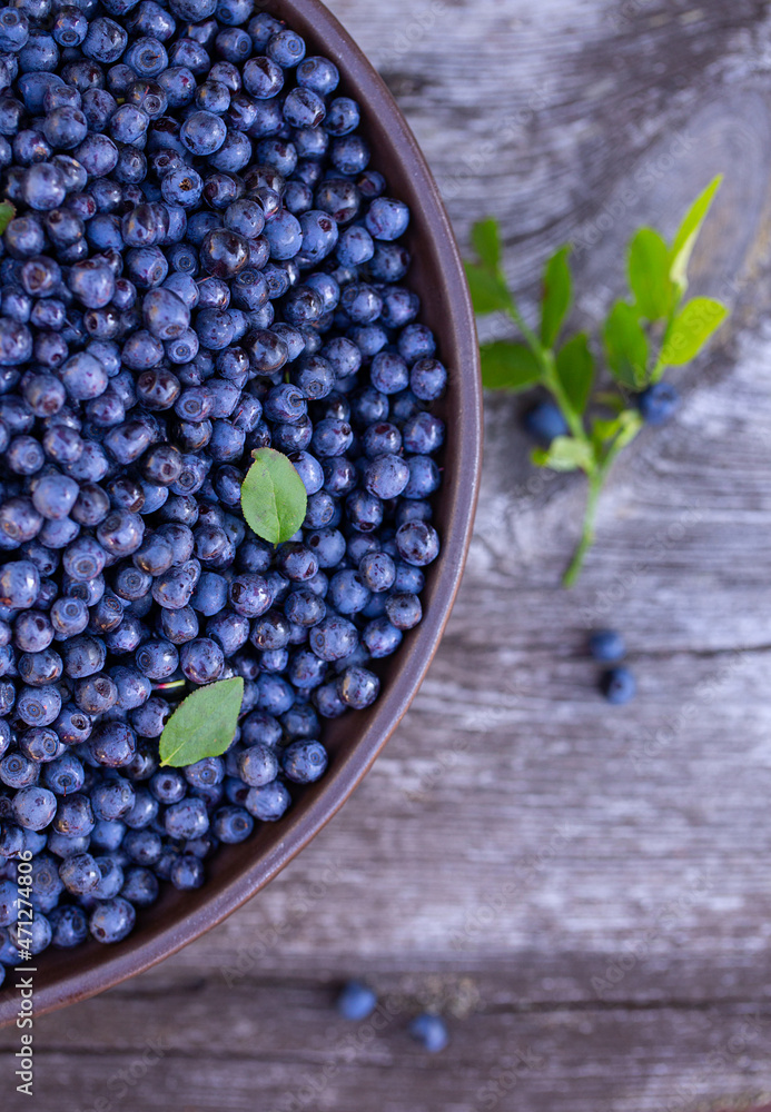 wild blueberries on rustic wooden surface wild blueberries on rustic wooden surface
